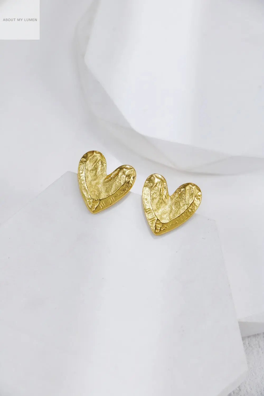 Rock-Carved Silver & Gold-Tone Earrings ABOUT MY LUMEN